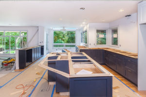Residential kitchen home remodeling project with white walls, blue cabinets, floor-to-ceiling windows in Springfield, IL.