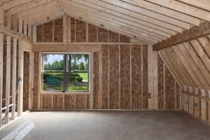 Bedroom addition on a residential home in Springfield, IL with a large window and carpeted floors.