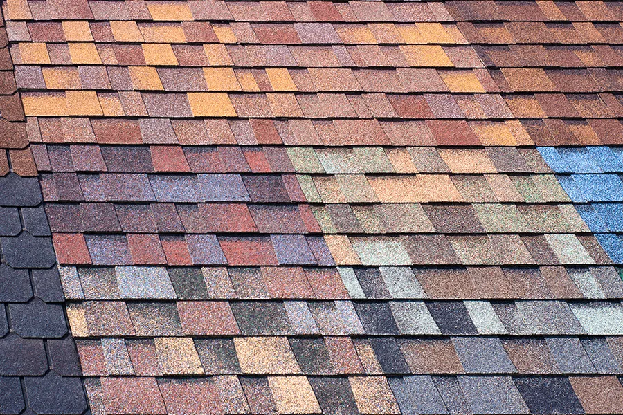 Multi-colored shingles as a sample of product advertising for new roof colors in Springfield, IL