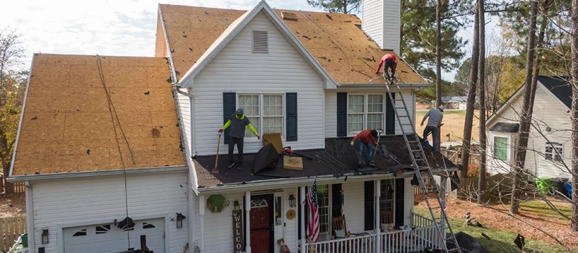 A residential roof replacement being carried out by professional roofers in Springfield, IL.